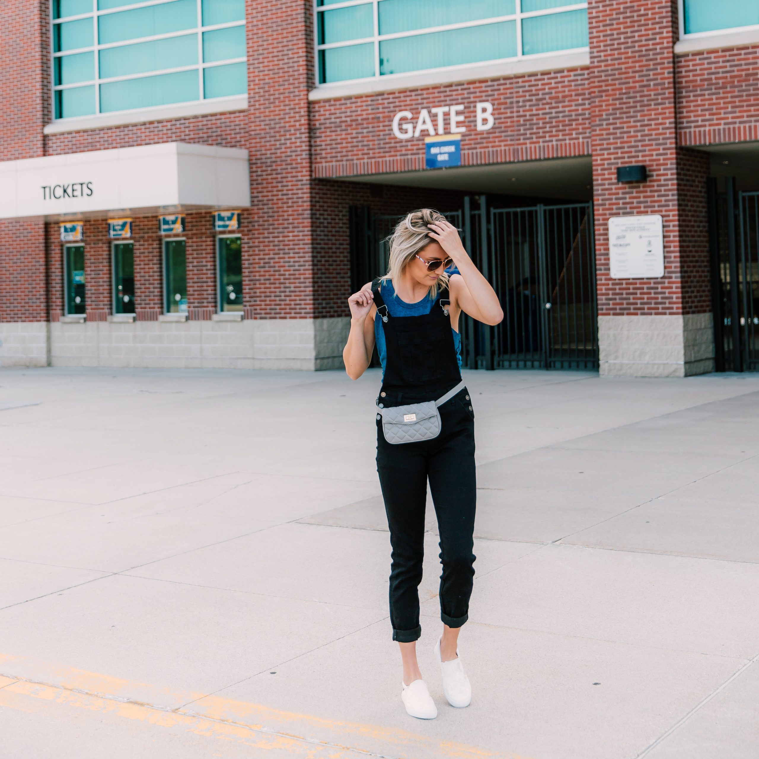 Practical Chic: Black Overalls with Fanny Pack — College Game Day Outfits 2026
