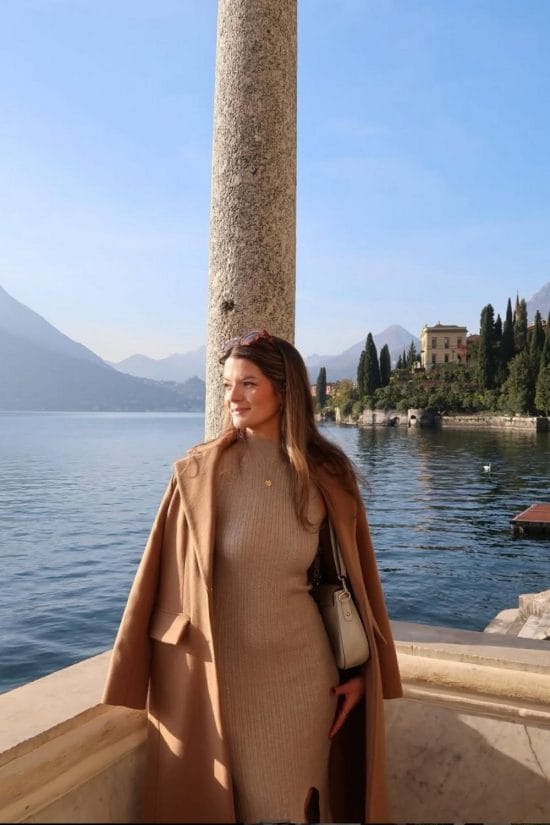 Camel Wool Coat Draped Over a Beige Knit Dress Camel Wool Coat Draped Over a Beige Knit Dress — Travel Outfits Europe 2027