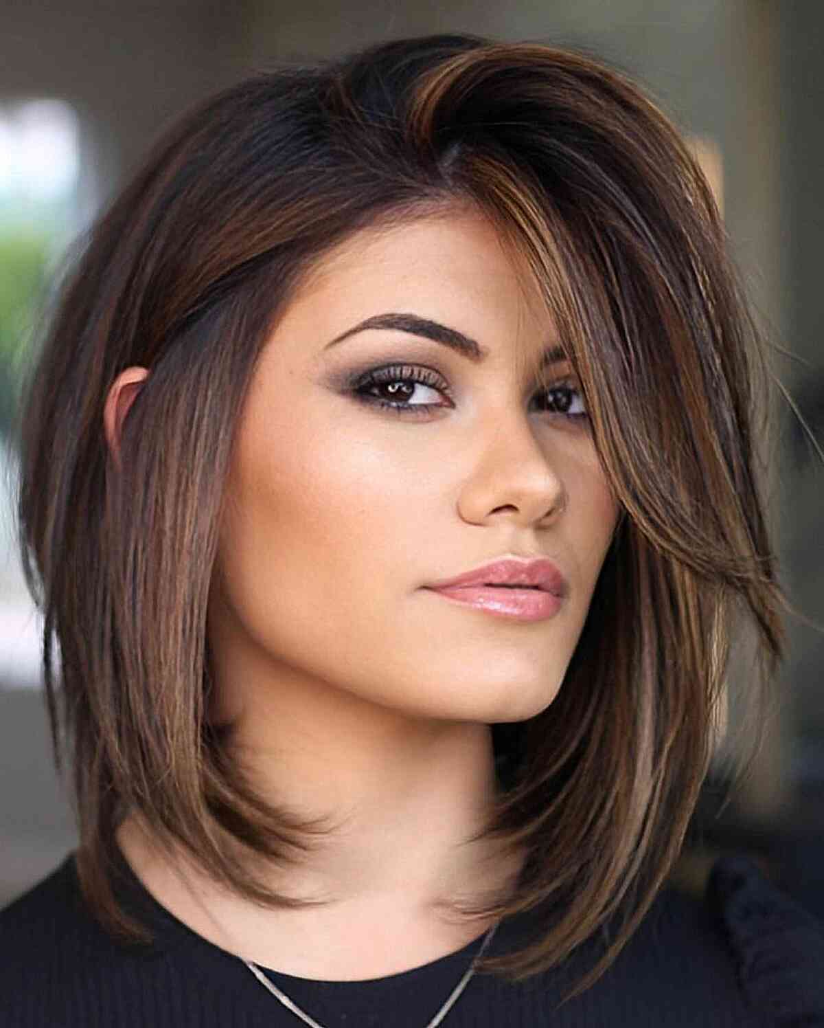 Angled Bob With Side-Swept Bangs Angled Bob With Side-Swept Bangs — Trendy Haircuts 2027