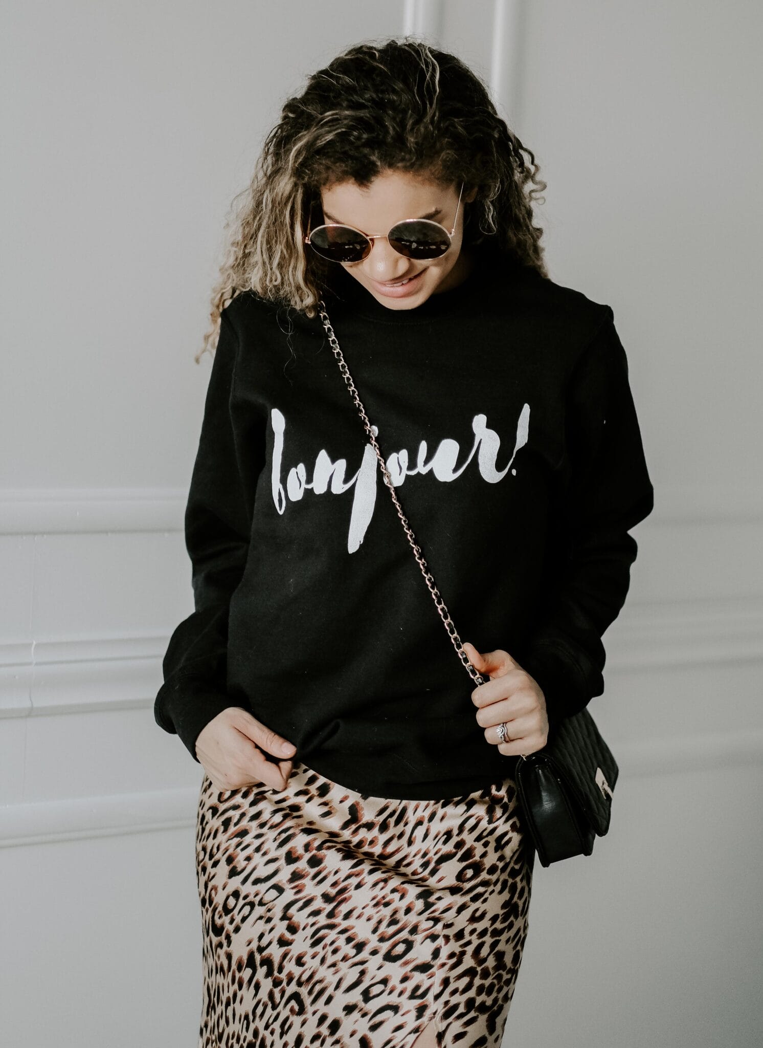 Bold Mix: Black Graphic Sweatshirt with Leopard Skirt Bold Mix: Black Graphic Sweatshirt with Leopard Skirt — Sweatshirt Outfits 2027