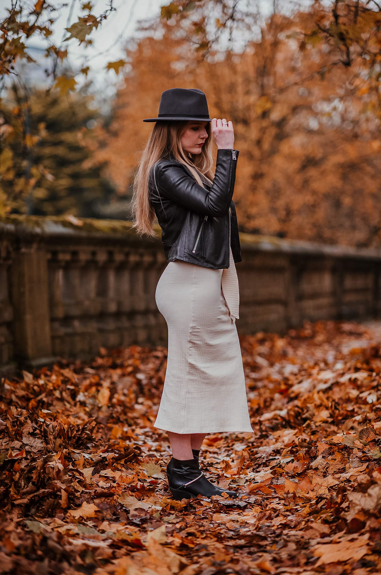 Streamlined Chic: Leather Jacket with Cream Knit Midi Dress and Fedora Streamlined Chic: Leather Jacket with Cream Knit Midi Dress and Fedora — Dress 2027 with Leather Jacket Outfit
