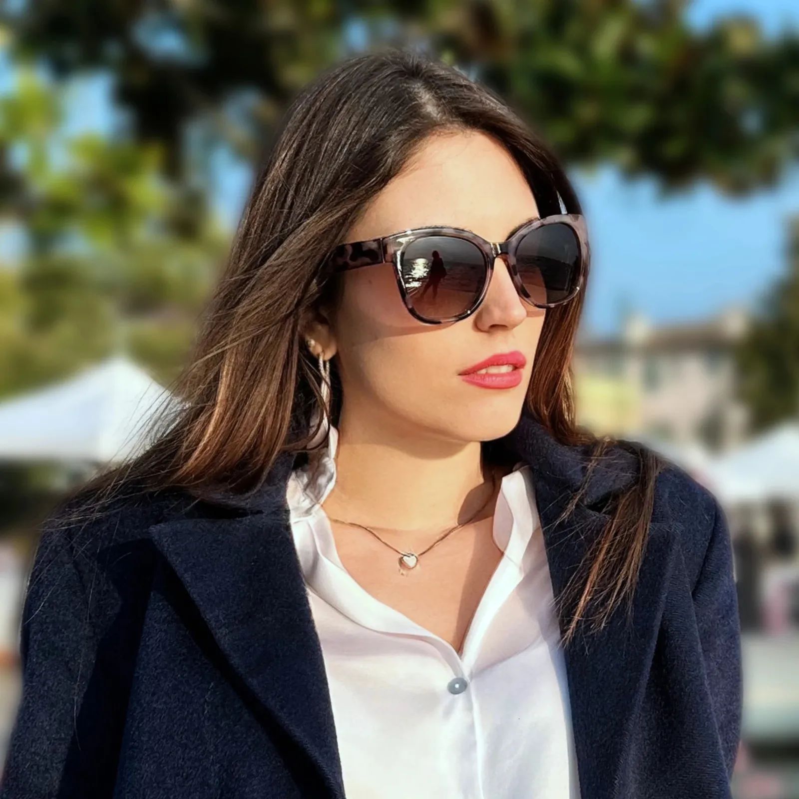 Layered Navy Coat Over White Shirt with Tortoiseshell Cat Eyes — Cat Eye Sunglasses Outfits 2027