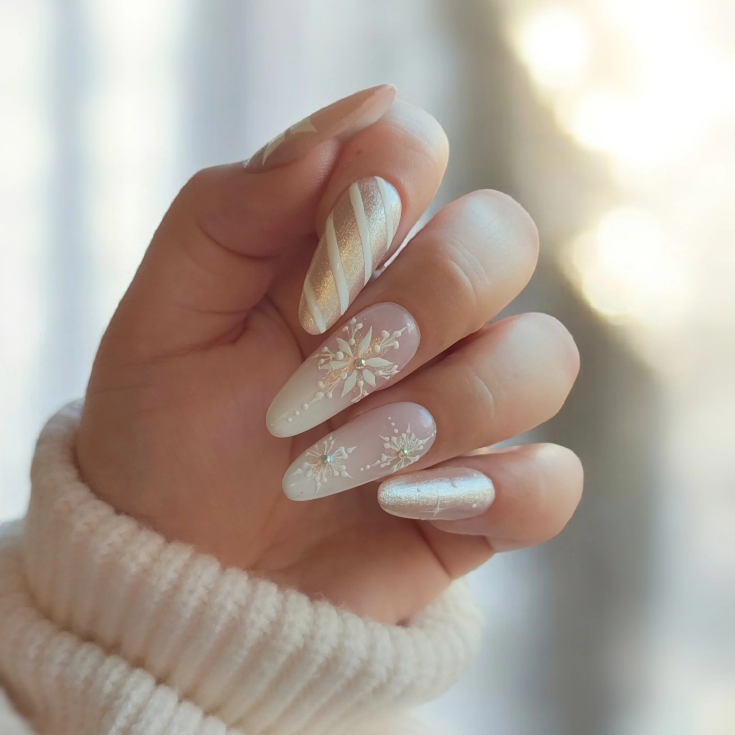 Champagne Shimmer Almonds with Snowflakes Champagne Shimmer Almonds with Snowflakes — Christmas Acrylic Nails 2026
