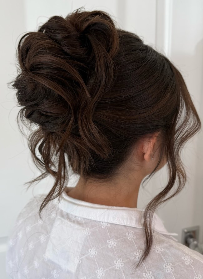 Loose Textured Bun With Soft Tendrils — Wedding Updos 2027