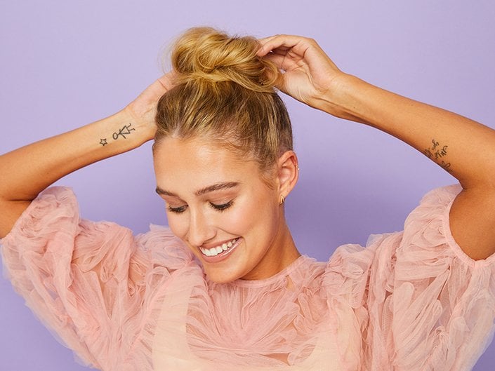 Blonde High Messy Bun With Loose Wisps Blonde High Messy Bun With Loose Wisps — Second Day Hairstyles 2027