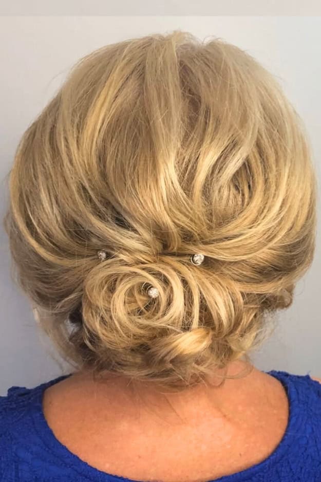 Blonde Wavy Rolled Low Bun with Pins Blonde Wavy Rolled Low Bun with Pins — Updos 2027 for Short Hair
