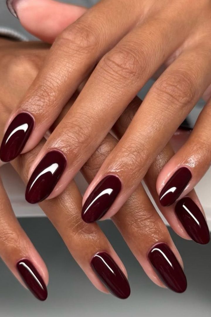 None Deep Opaque Burgundy Glossy Oval Nails None Deep Opaque Burgundy Glossy Oval Nails — Winter Nail Colors 2027 for Dark Skin