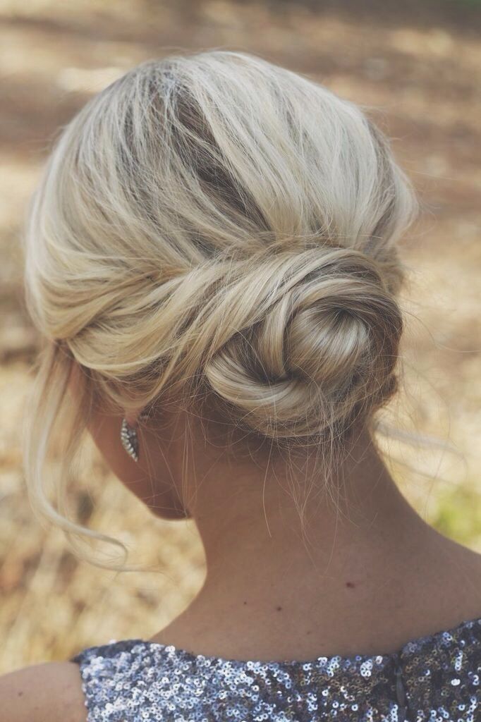 Low Bun With Twisted Details Visual Idea Low Bun With Twisted Details Visual Idea — Holiday Hairstyles 2026