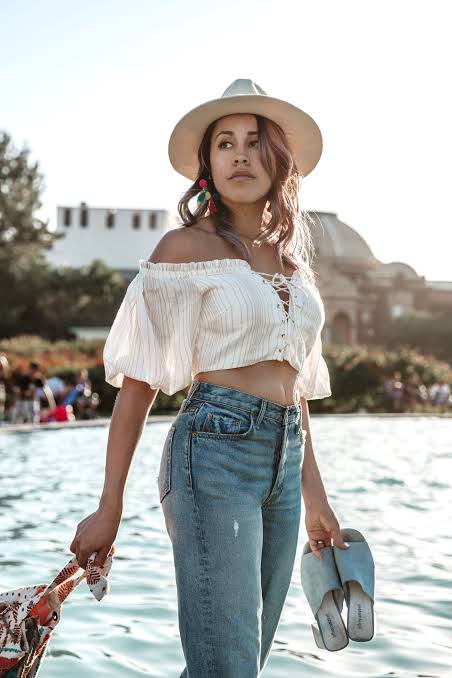 Striped Off-the-Shoulder Crop Top with High-Waisted Jeans and Tassel Earrings Striped Off-the-Shoulder Crop Top with High-Waisted Jeans and Tassel Earrings — Summer Crop Top Outfits 2027