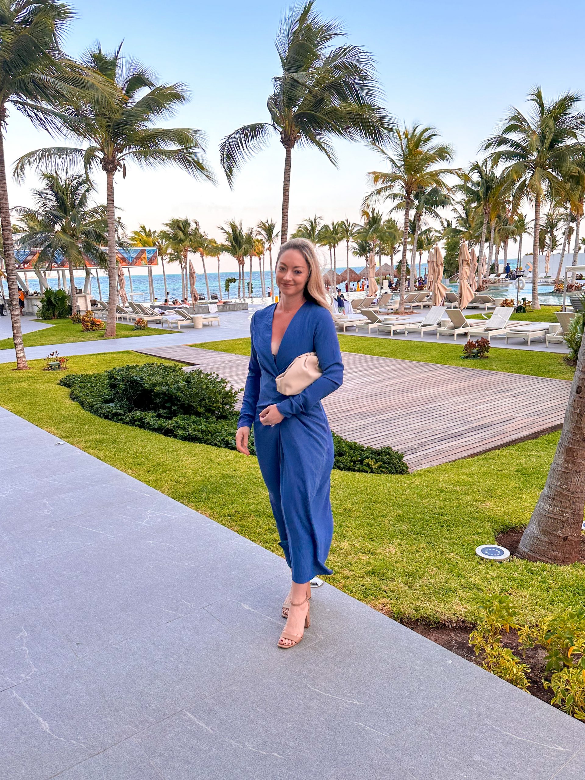 Sophisticated Blue Wrap Dress for Resort Evenings — Cancun Outfits 2027