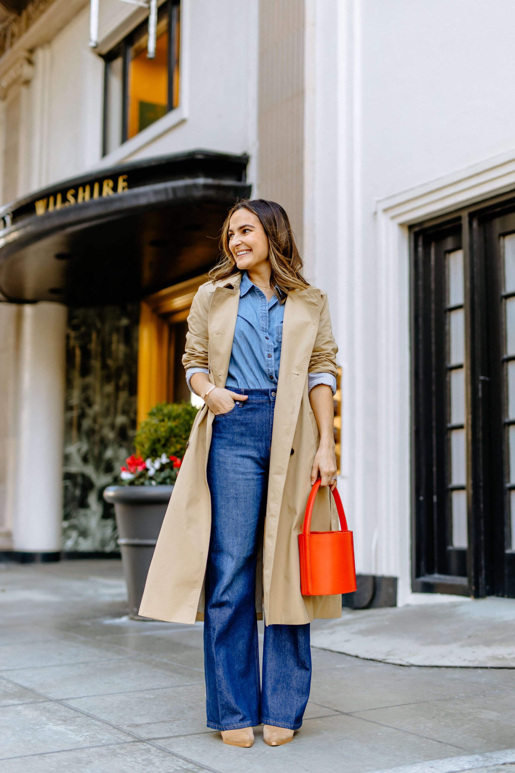 Beige Trench Coat with Denim Shirt and Red Handbag — Spring Outfits 2027 with Trench Coat