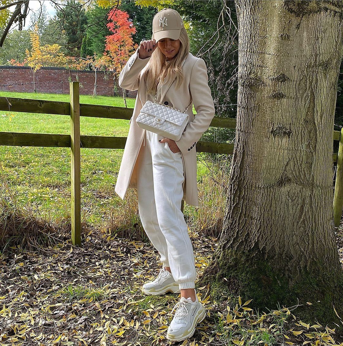 Beige Long Coat with White Pants and Baseball Cap — Beige Spring Outfits 2027