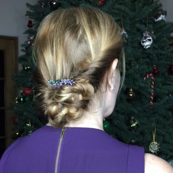 Low Updo with Hair Accessory — Holiday Party Hairstyles 2026