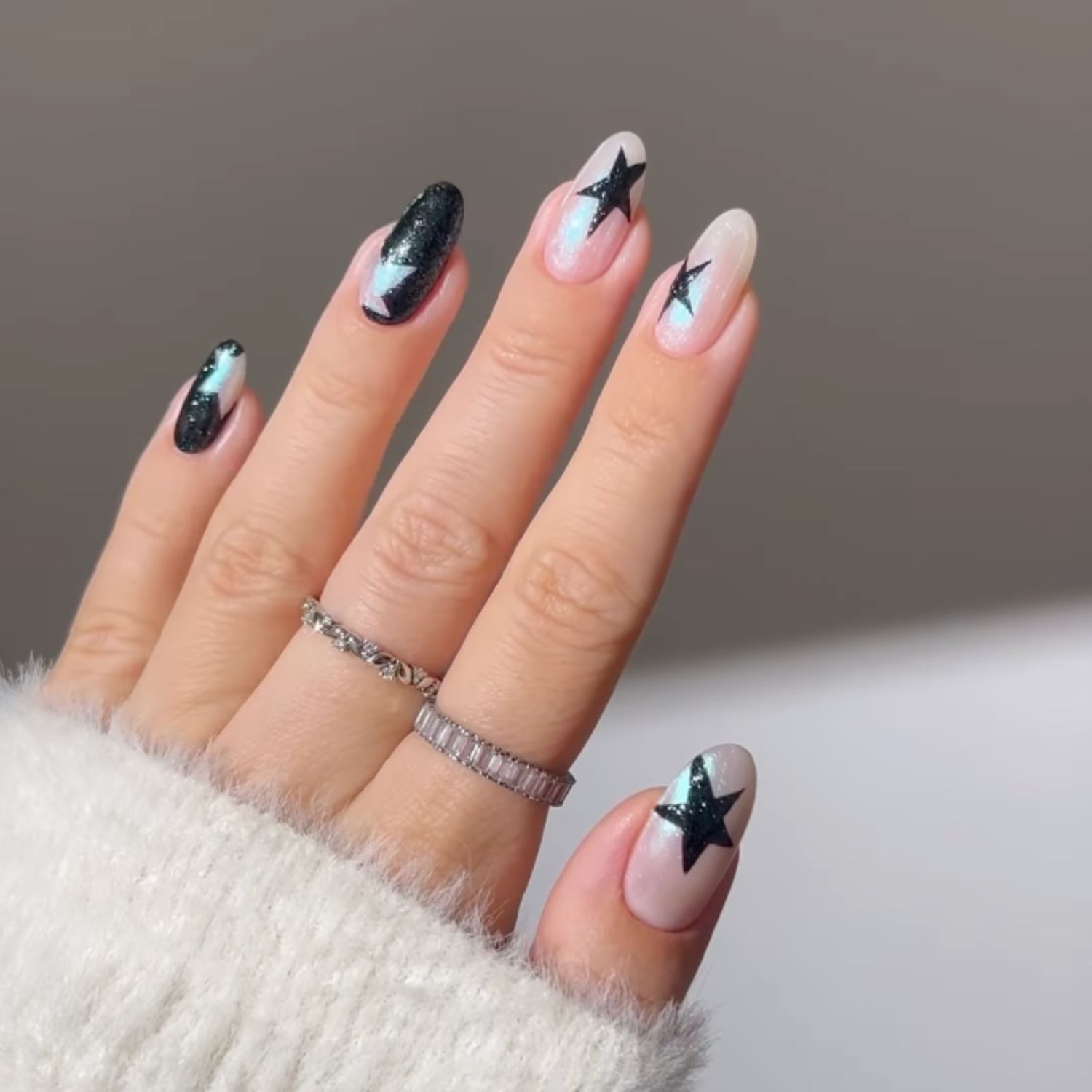 Iridescent White with Bold Black Stars — Moon and Stars Nails 2027