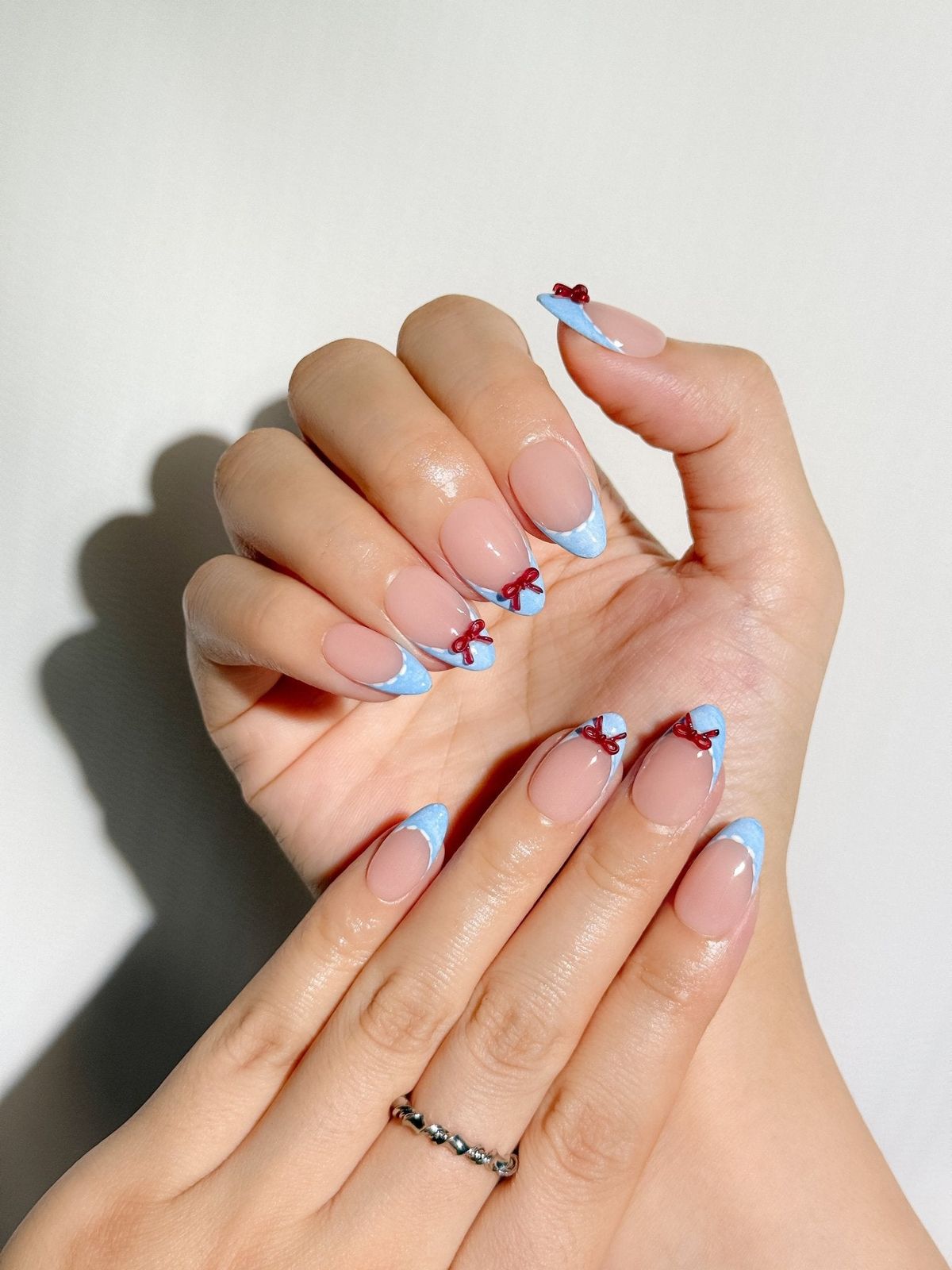 Medium Almond Blue French Red Bows Medium Almond Blue French Red Bows — Simple Bow Nails 2027