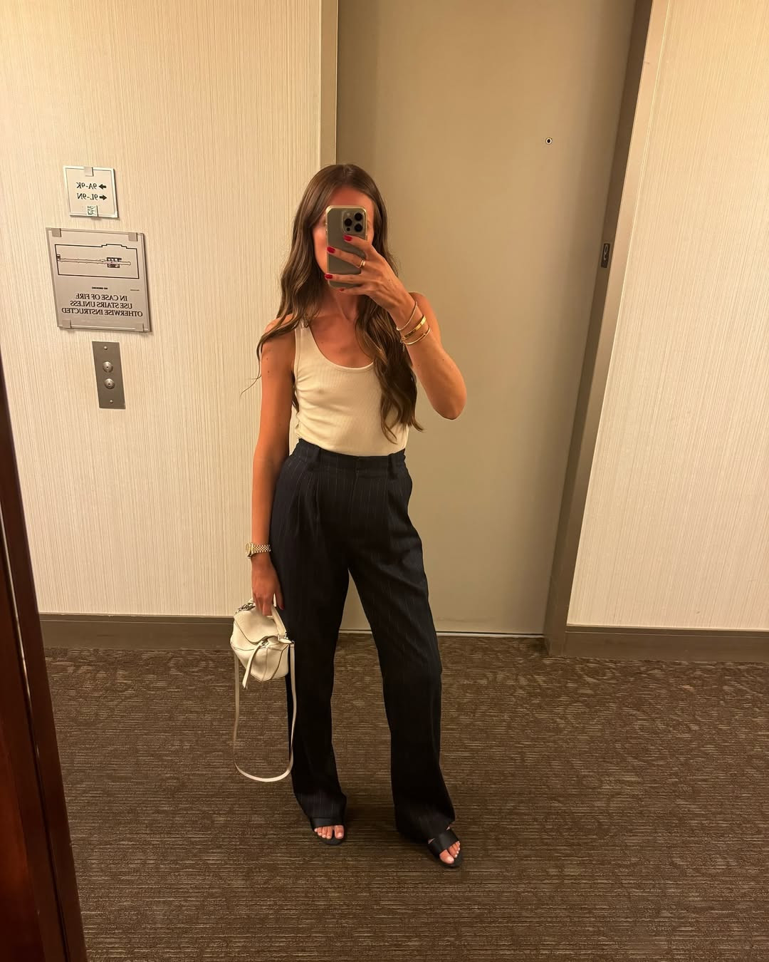Polished Casual: Cream Tank with Pinstripe Trousers Polished Casual: Cream Tank with Pinstripe Trousers — Racerback Tank Top Outfits 2027