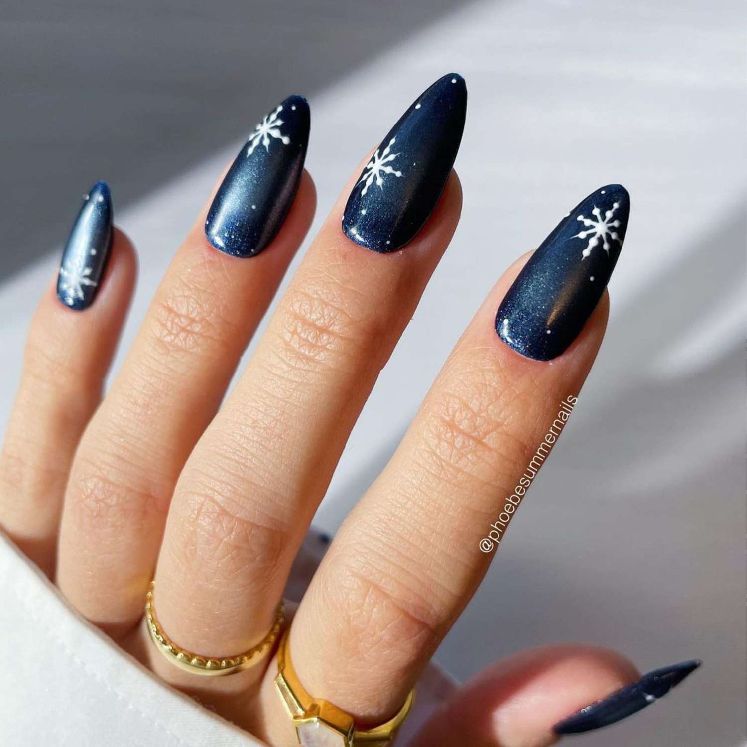 Shimmering Dark Blue Snowflake Almonds Shimmering Dark Blue Snowflake Almonds — Blue Christmas Nails 2026