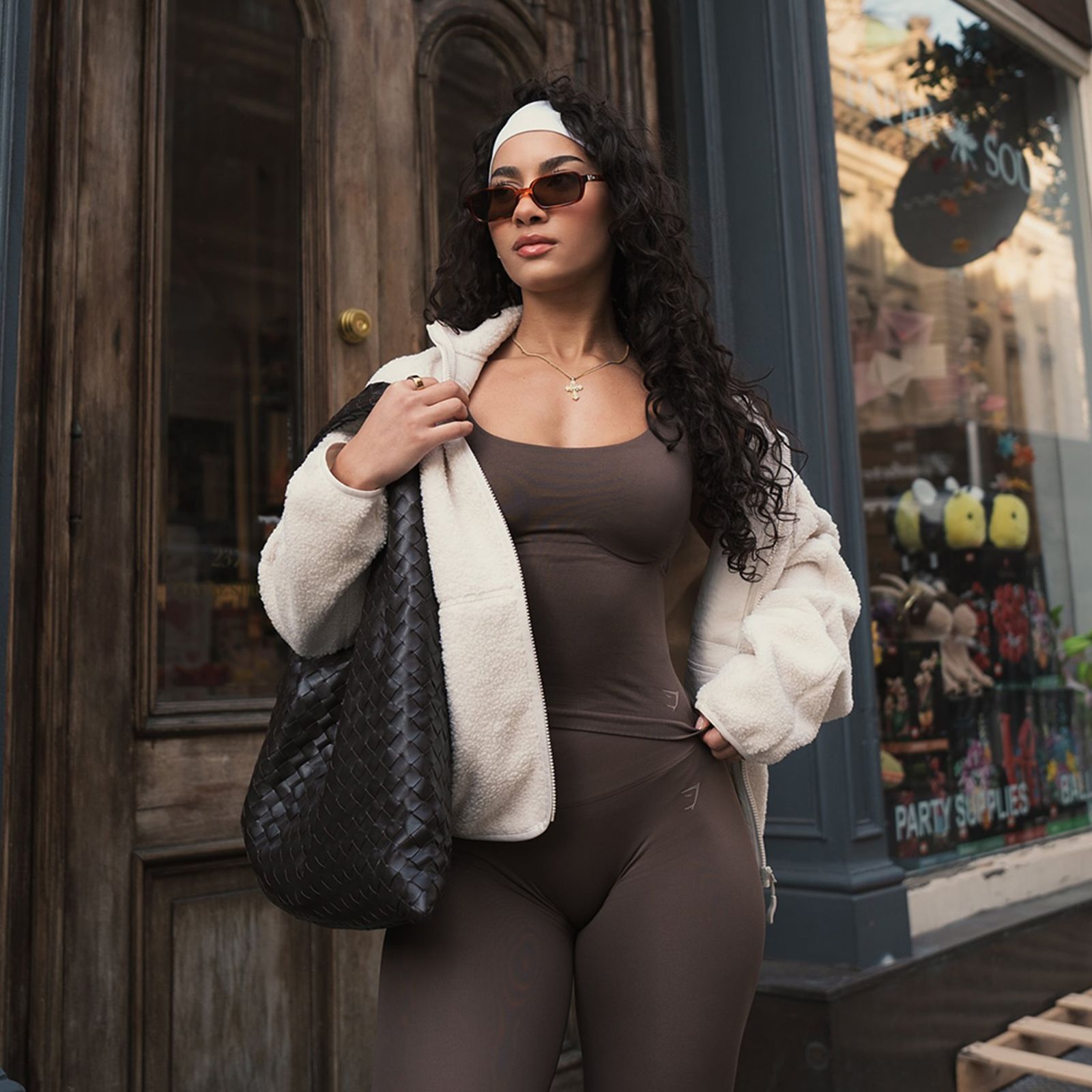 Brown Seamless Bodysuit and Leggings with a Cream Teddy Fleece Jacket — Streetwear Gym Outfits 2027