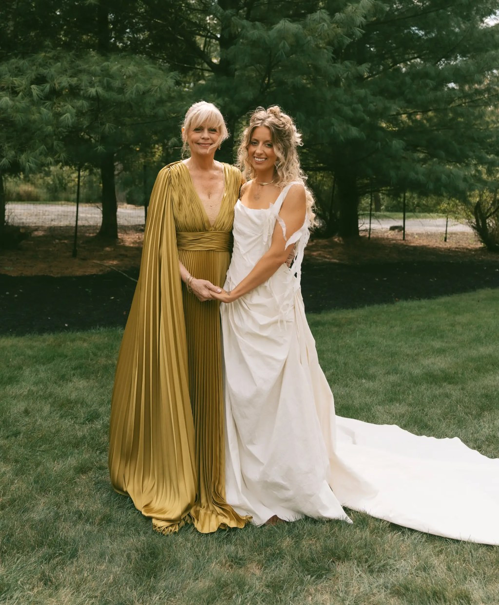 Dramatic Gold Pleated Gown with Cape Sleeves Dramatic Gold Pleated Gown with Cape Sleeves — Grandmother of the Bride Outfits 2027