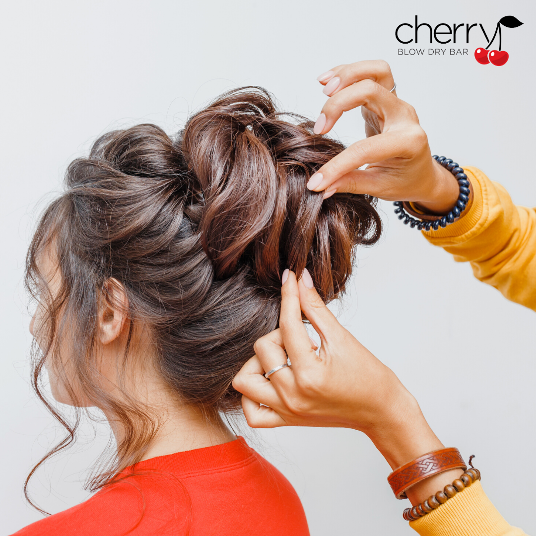 Mid-Back Messy Updo with Loose Tendrils — Holiday Party Hairstyles 2026