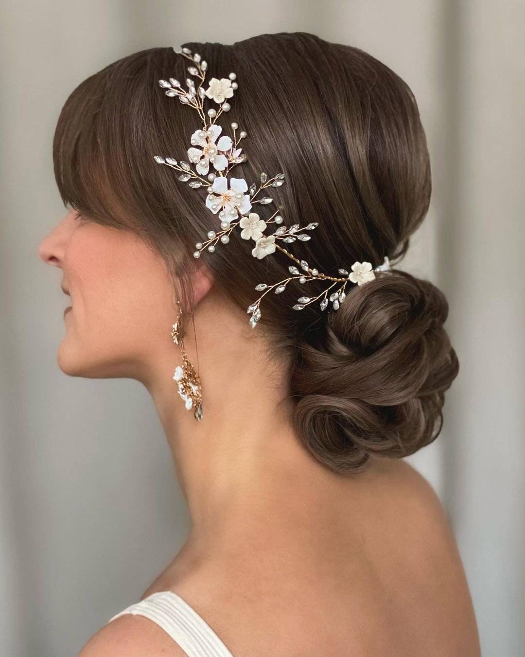 Dark Brown Low Bun With Curtain Bangs Dark Brown Low Bun With Curtain Bangs — Wedding Bangs 2027