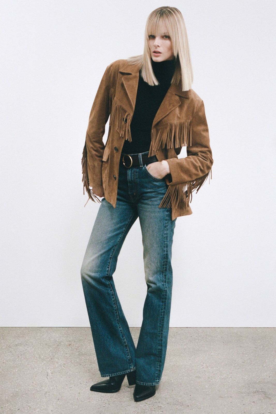 Brown Suede Fringe Jacket and Black Turtleneck with Blue Bootcut Jeans Brown Suede Fringe Jacket and Black Turtleneck with Blue Bootcut Jeans — Blue Bootcut Jeans Outfits 2027