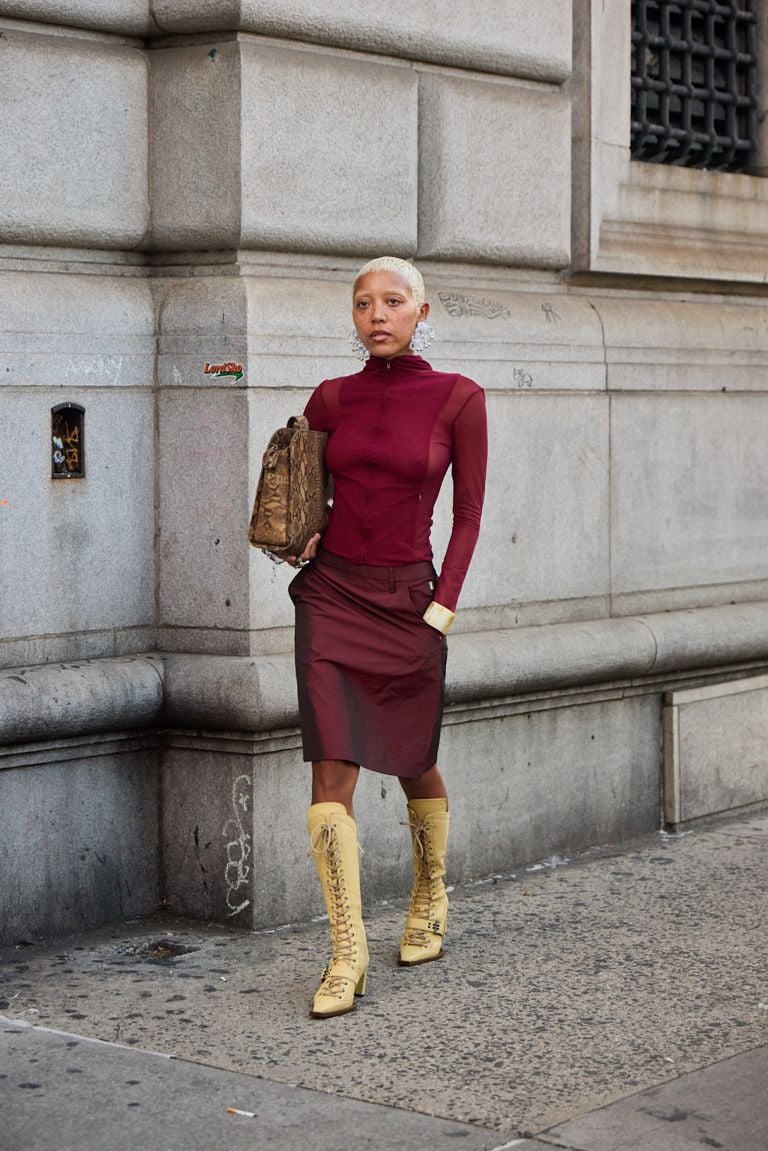 Fashion-Forward Burgundy Mesh Top with Satin Skirt and Yellow Boots — Burgundy Outfits 2027