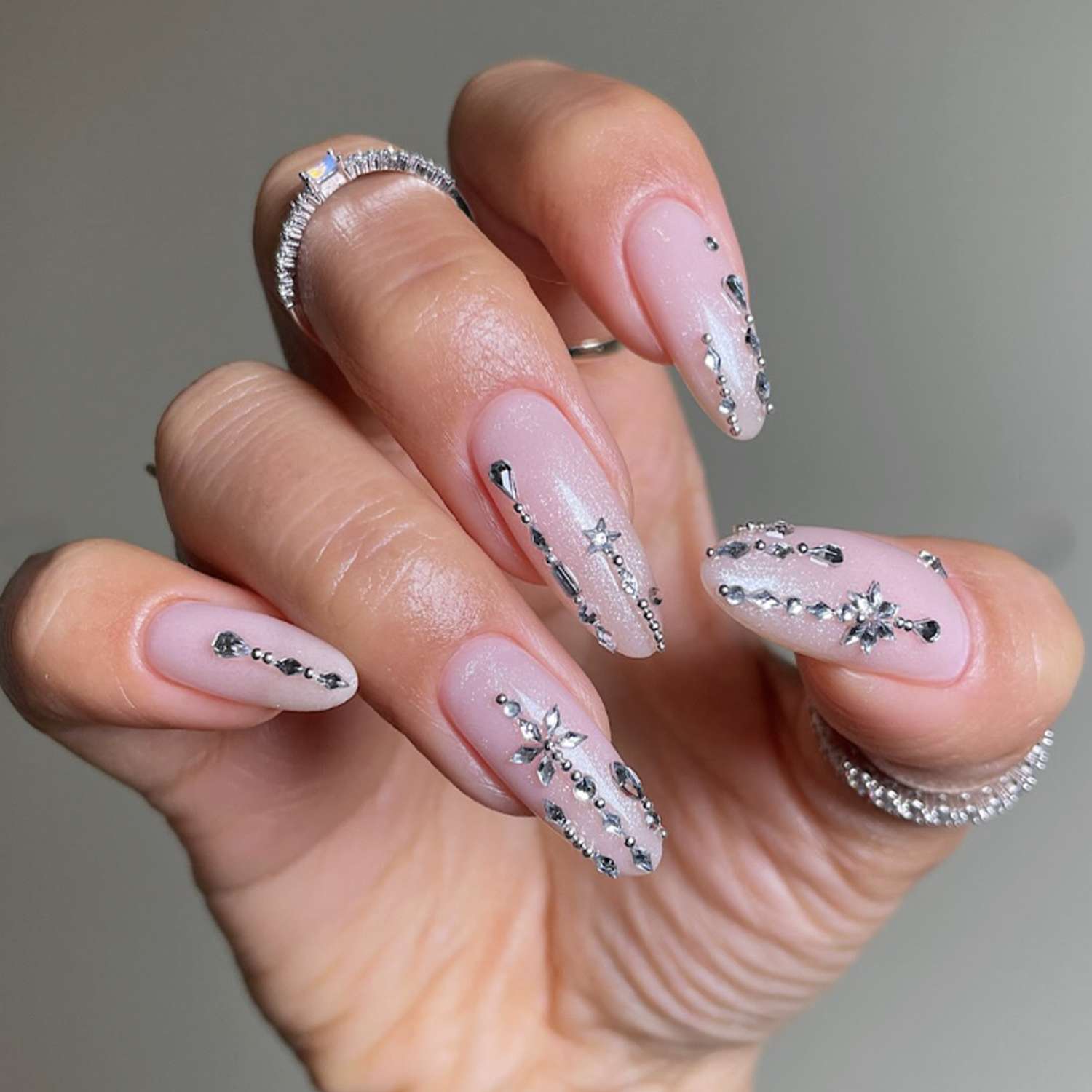 Sheer Pink Rhinestone Charm Oval Nails Sheer Pink Rhinestone Charm Oval Nails — Medium Length Winter Nails 2027