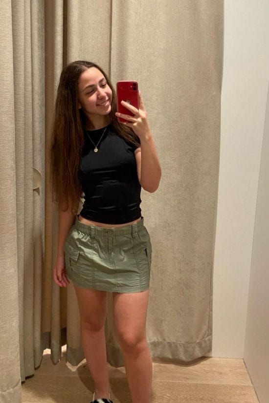 Olive Green Cargo Mini Skirt with Black T-Shirt and Sneakers — Accessorized With A Simple Necklace Olive Green Cargo Mini Skirt with Black T-Shirt and Sneakers — Accessorized With A Simple Necklace — Olive Green Mini Skirt O