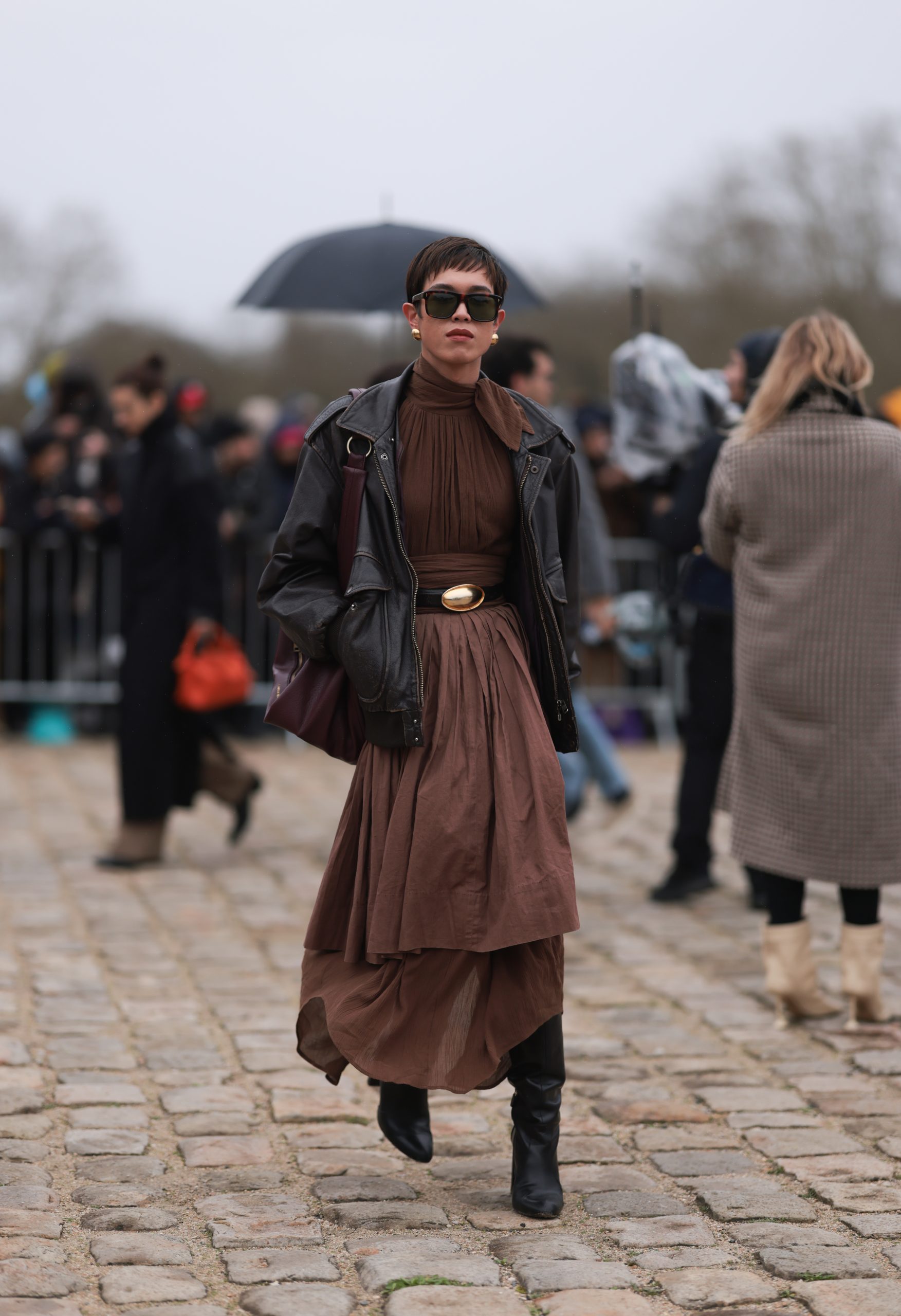 Black Leather Jacket Over Tiered Dress with Gold Belt for Fashion Forward — Dressy Winter Outfits 2027