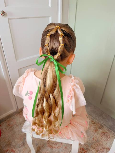 Dark Brown Two Braids with Floral Ties Dark Brown Two Braids with Floral Ties — Easter Hairstyles 2027