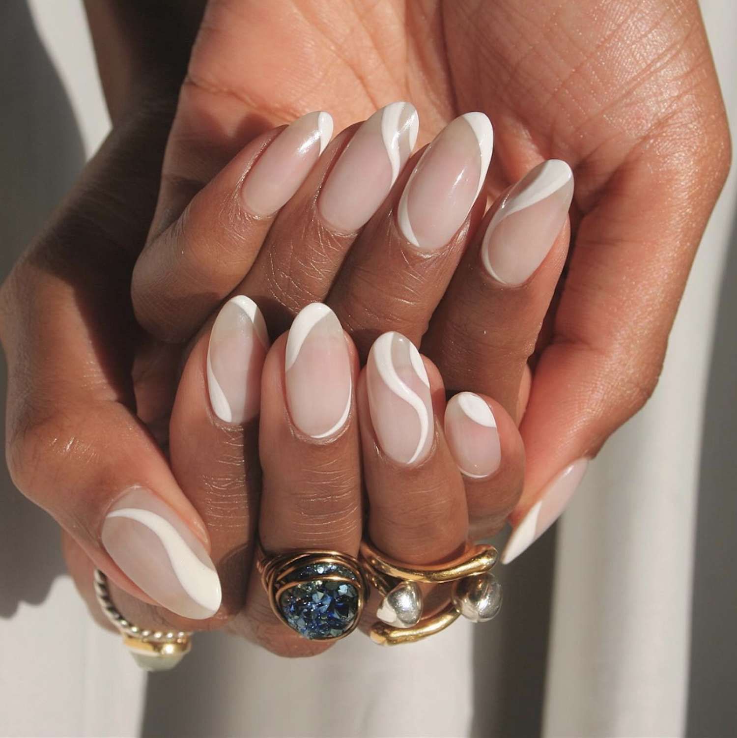 Abstract Swirl Sheer Nude Almonds — Almond Nails 2027 for Chubby Fingers
