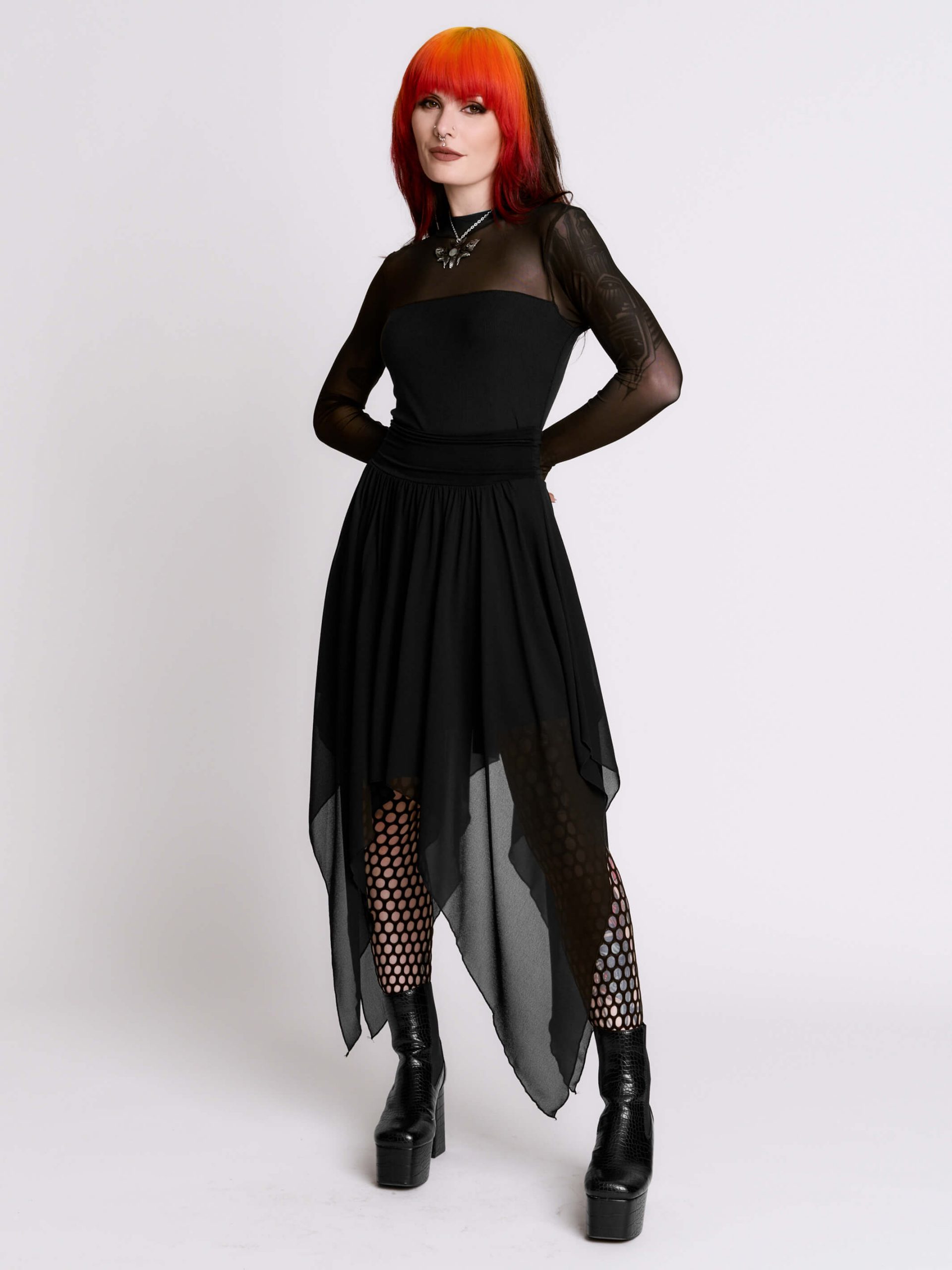 Layered Asymmetric Dress Styled with Fishnet Tights Layered Asymmetric Dress Styled with Fishnet Tights — Dark Romantic Outfits 2027