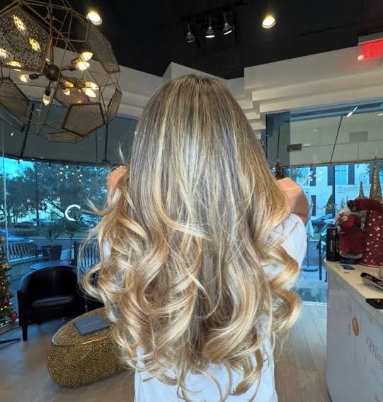 Mid-Back Dark Blonde Voluminous Curls Mid-Back Dark Blonde Voluminous Curls — Blonde Balayage 2027