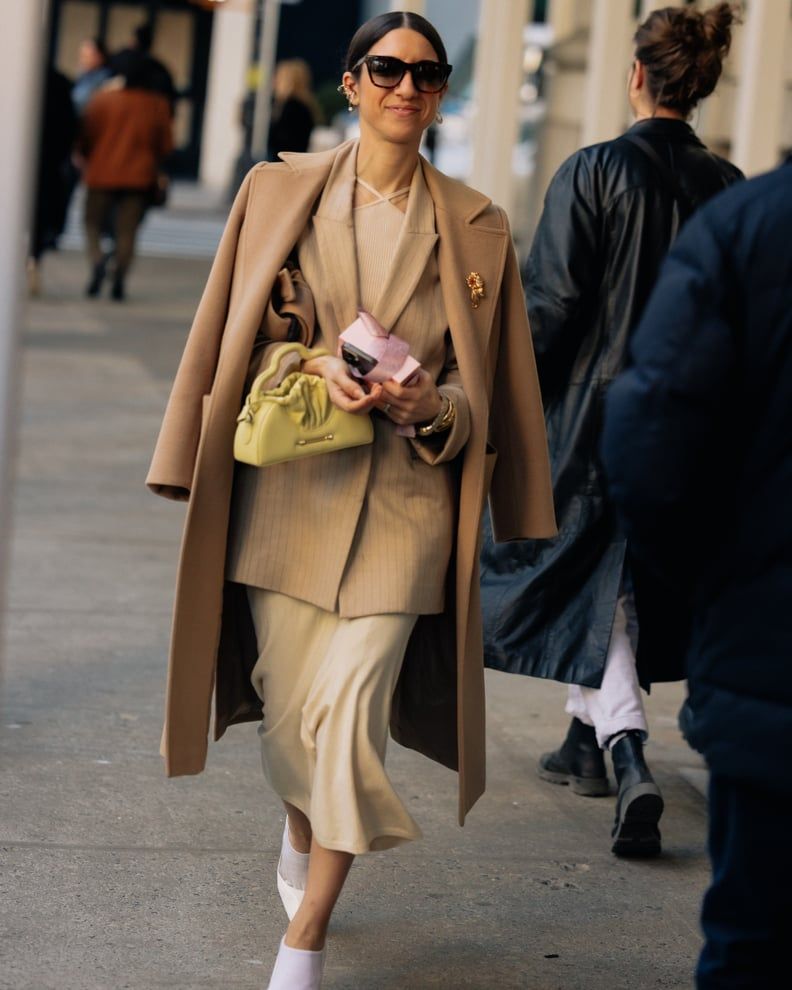 Elegant Draping: Camel Coat Over Layered Beige Ensemble — Cold Weather Outfits 2027