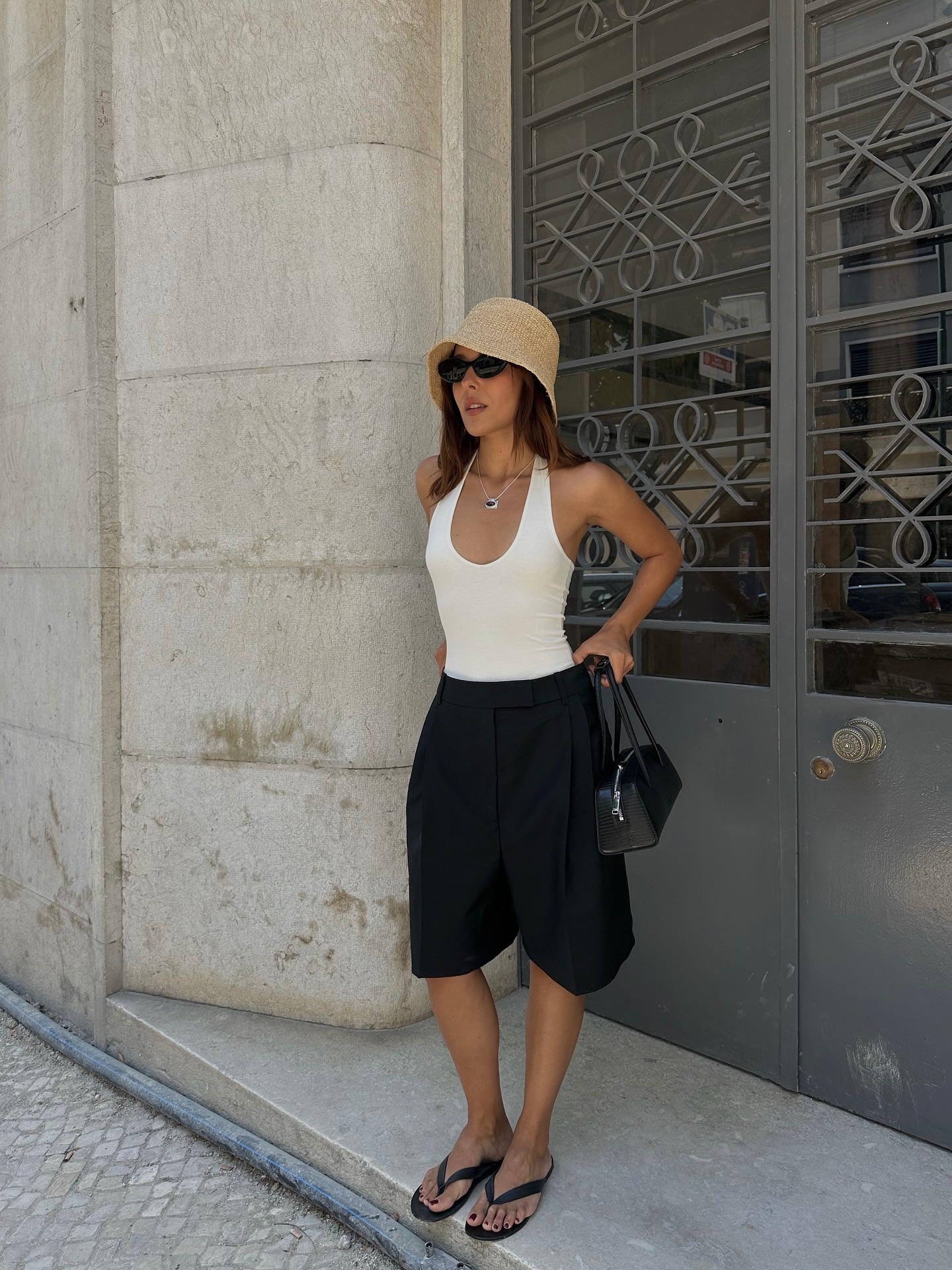 Minimalist Black Tailored Shorts with Halter Top and Bucket Hat Minimalist Black Tailored Shorts with Halter Top and Bucket Hat — Summer Outfits 2027 with Shorts