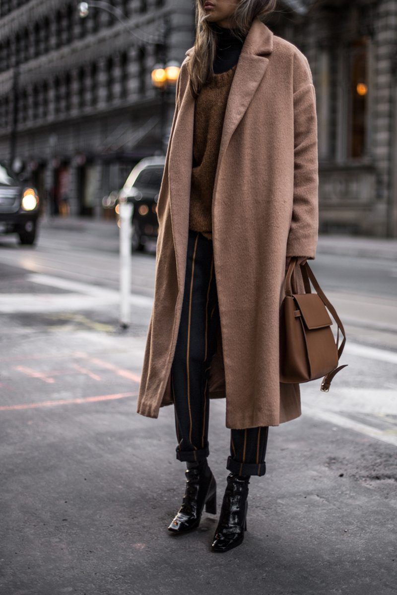 Camel Wool Coat Over Brown Knit Sweater and Pinstripe Trousers — Winter Minimalist Outfits 2027