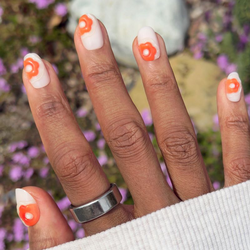Bold Orange Flower Motifs On White Tips Bold Orange Flower Tips Bold Orange Flower Motifs On White Tips Bold Orange Flower Tips — Floral Round Nails 2027