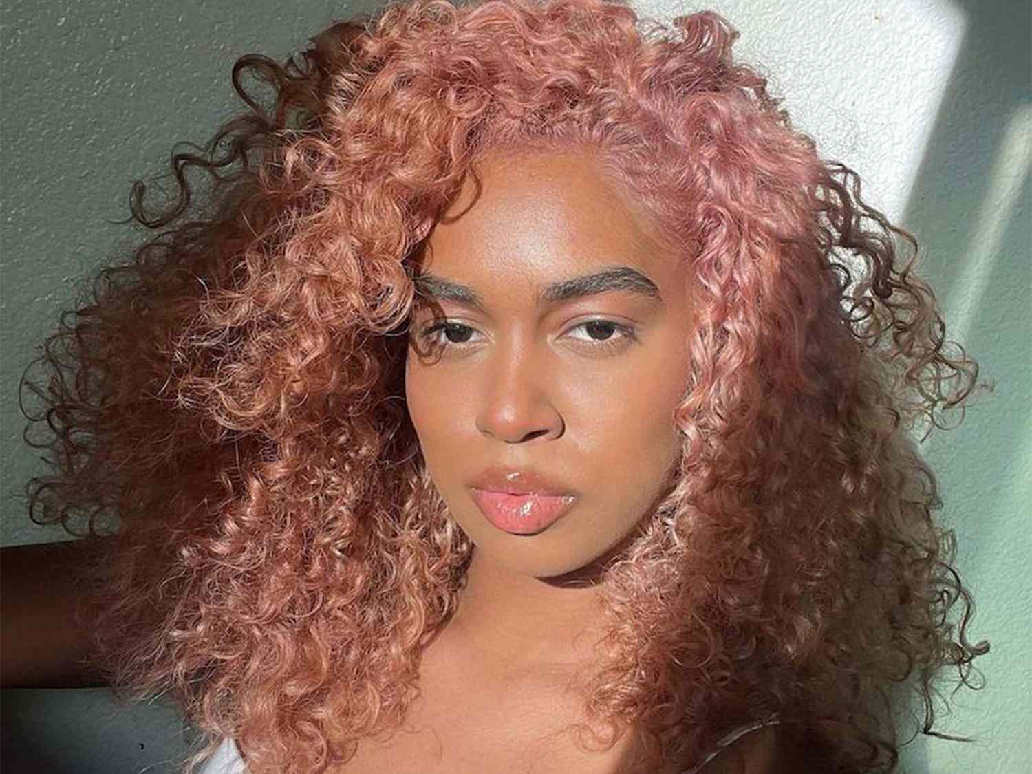 Pastel Rose Gold Shoulder-Length Lob Pastel Rose Gold Shoulder-Length Lob — Hair Color 2027 for Curly Hair