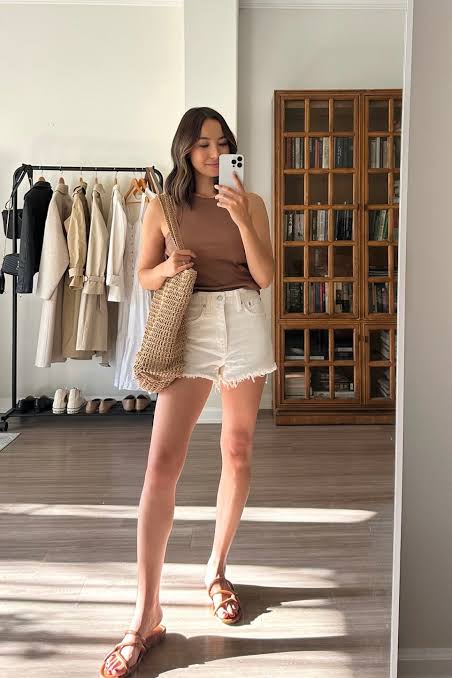 White Denim Shorts with Sleeveless Top and Woven Tote — Spring Denim Shorts Outfits 2027
