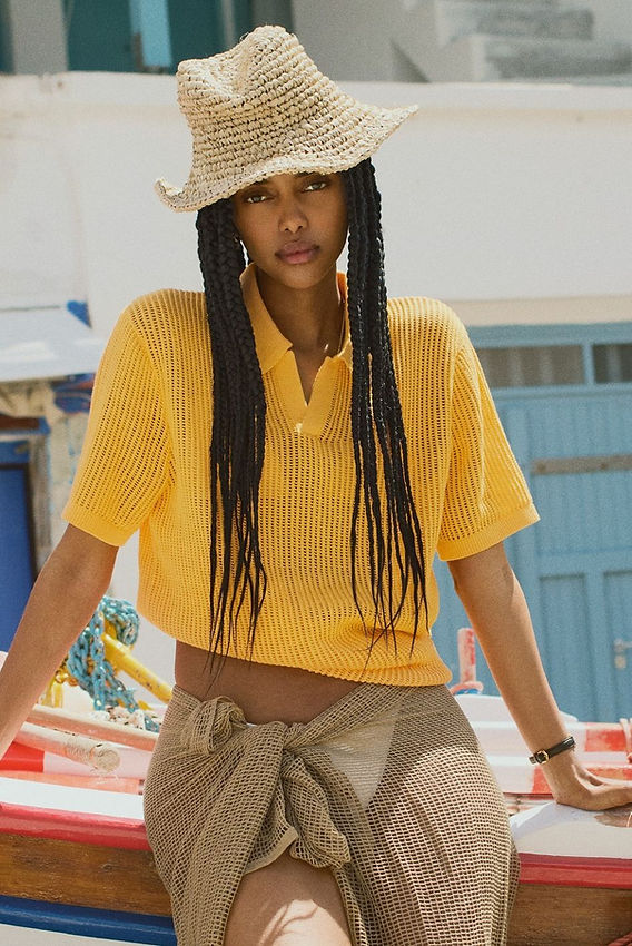 Textured Yellow Mesh Polo and Beige Wrap Skirt for Vacation — Minimalist Outfits 2027