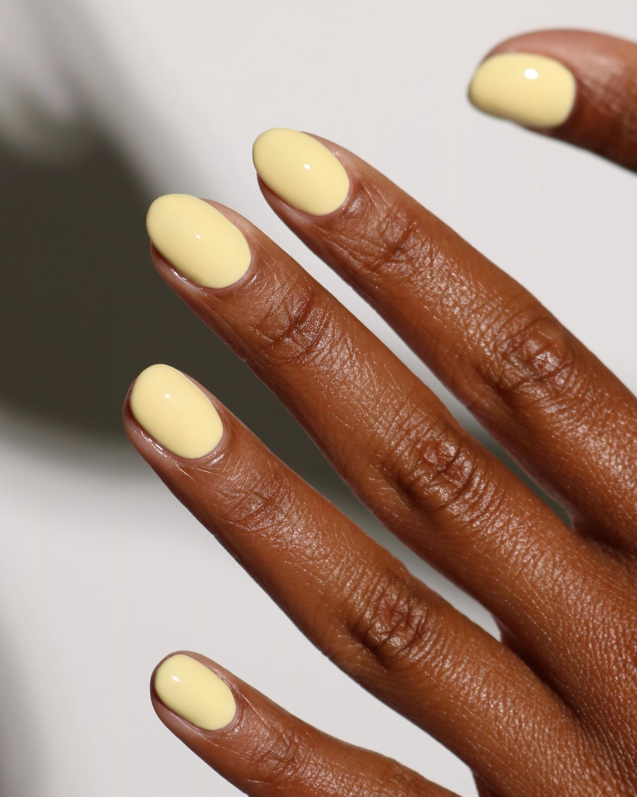 Opaque Pale Yellow Short Oval Nails — Pastel Nails 2027 for Dark Skin