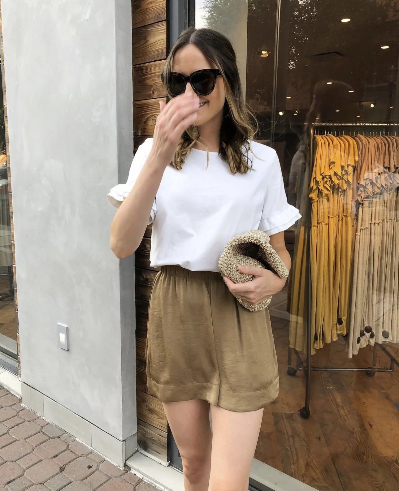 Gold Satin Shorts with Ruffled White Top and Woven Clutch Gold Satin Shorts with Ruffled White Top and Woven Clutch — Summer Outfits 2027 with Shorts