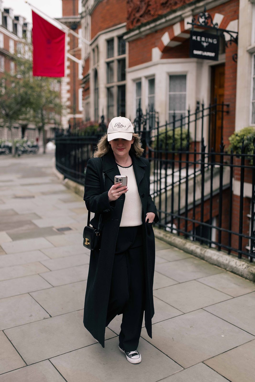 Black Wool Coat Over Cream Knit And Wide-Leg Pants Black Wool Coat Over Cream Knit And Wide-Leg Pants — Winter Dinner Outfits 2027