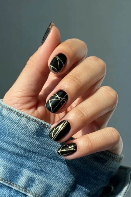 Abstract Gold Lines on Black Nails Abstract Gold Lines on Black Nails — New Years Eve Nails 2027