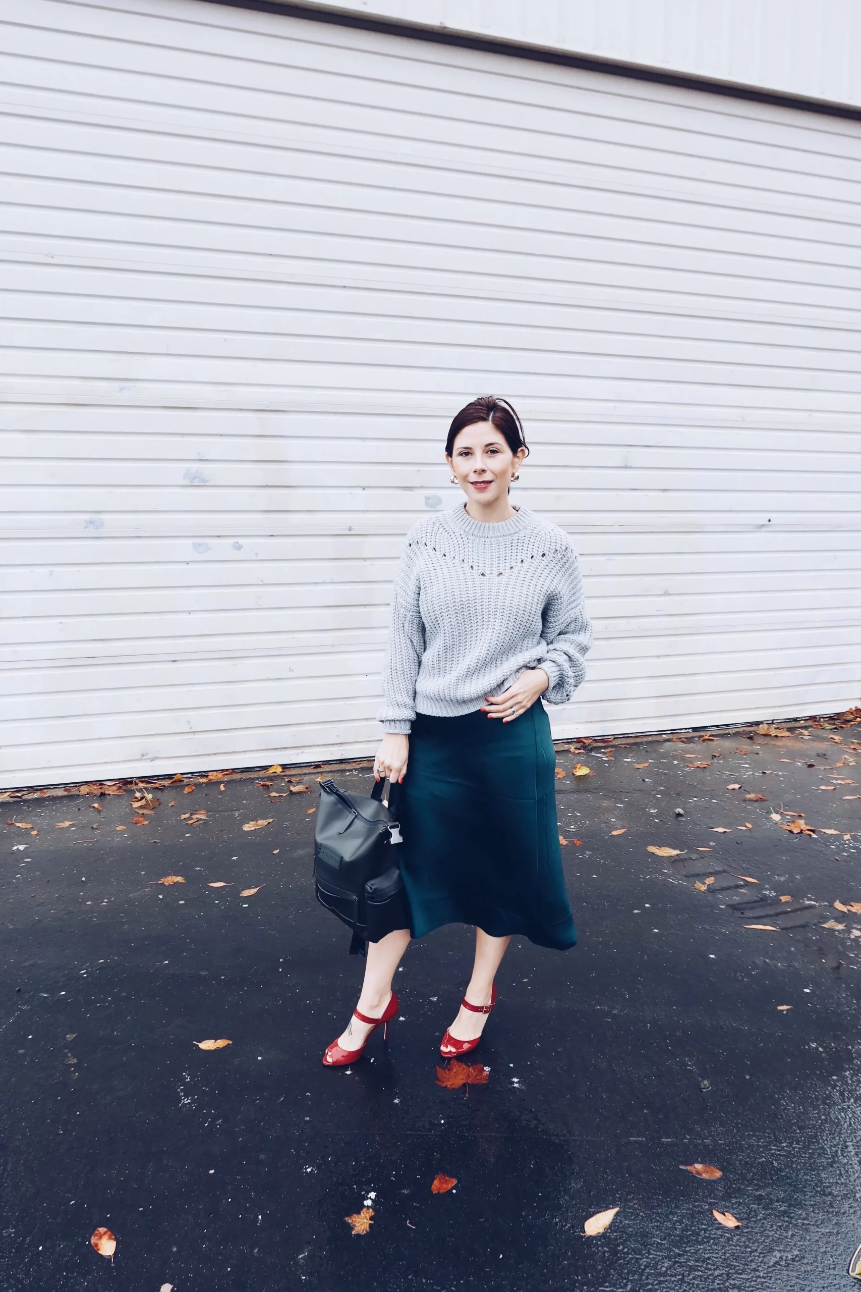 Chunky Knit Sweater with Emerald Green Satin Midi Skirt — Green Christmas Outfits 2026