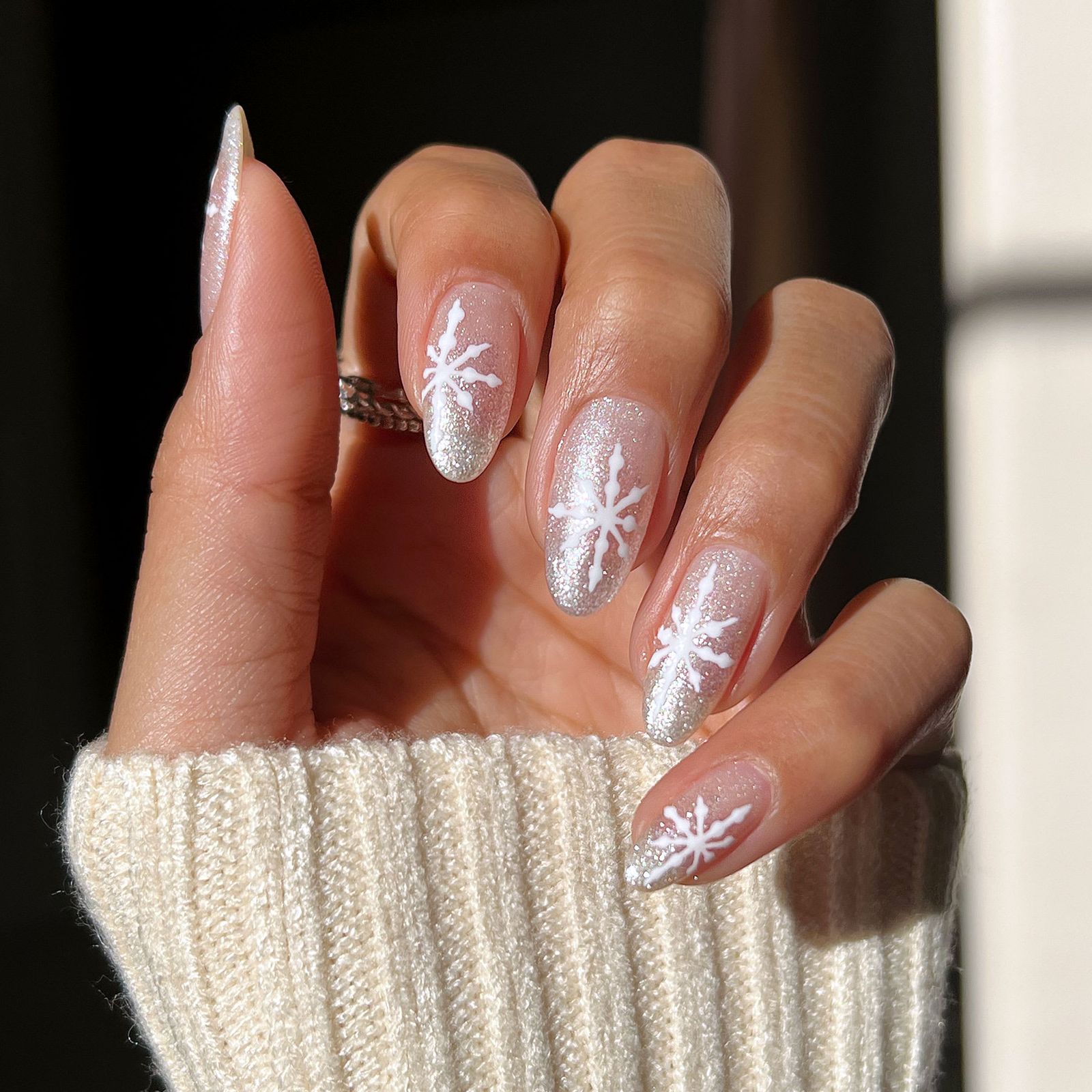 Sheer Glitter Almond Nails with Snowflakes Sheer Glitter Almond Nails with Snowflakes — Winter Formal Nails 2027