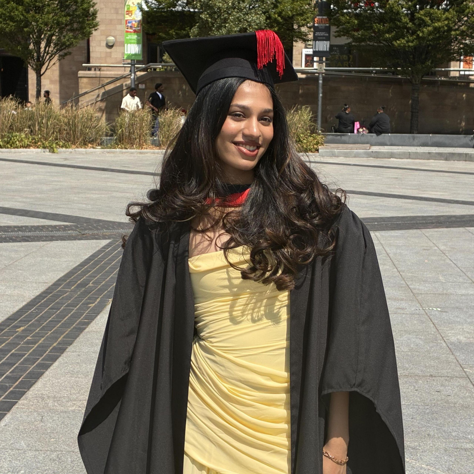 Graduation Gown Over a Bright Ruched Dress Graduation Gown Over a Bright Ruched Dress — Graduation Ceremony Outfits 2027