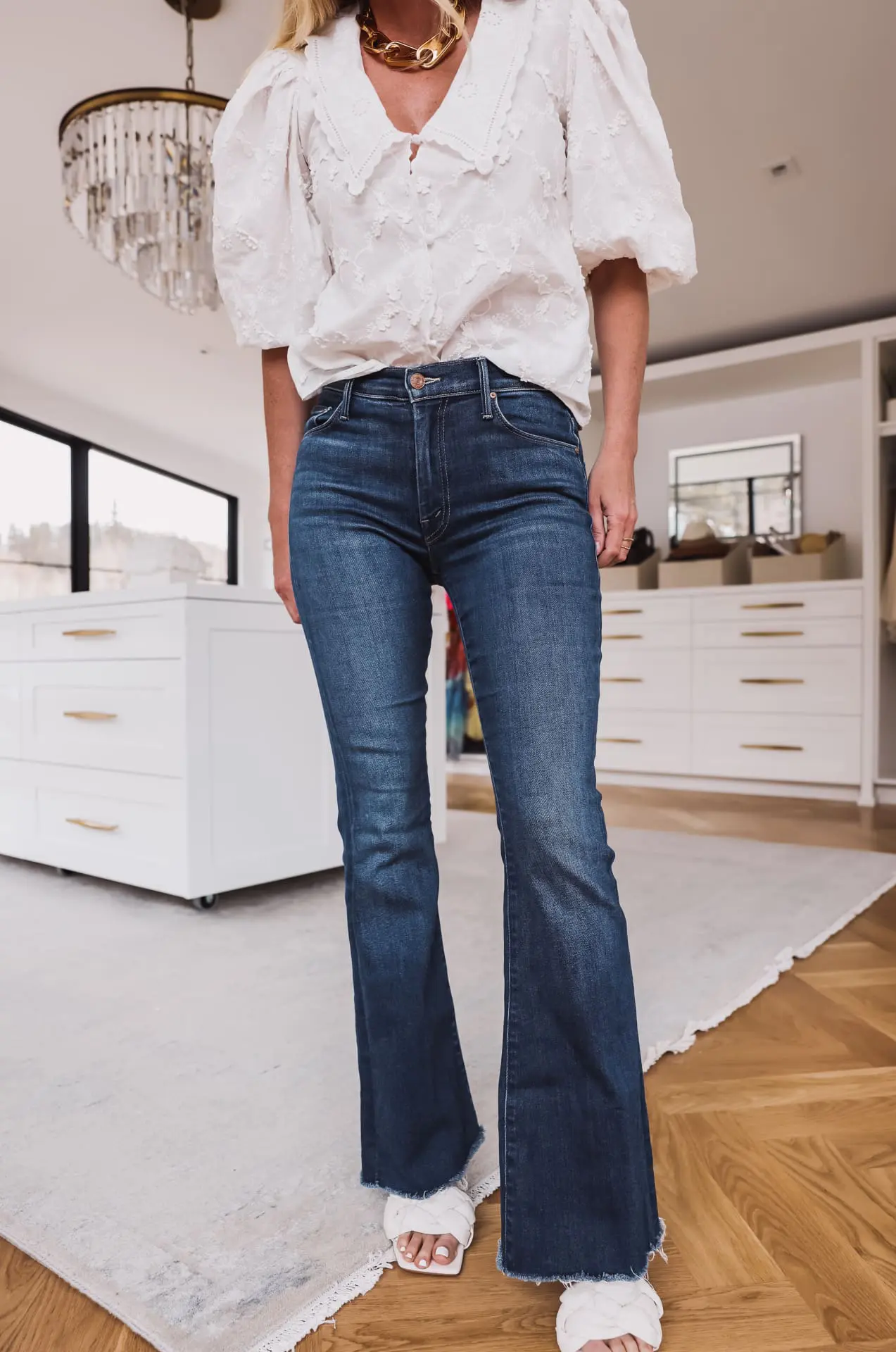 Casual Elegance: Dark Wash Bootcut Jeans with Puff Sleeve Blouse and Fluffy Sandals — Bootcut Jeans Outfits 2027 with Sandals