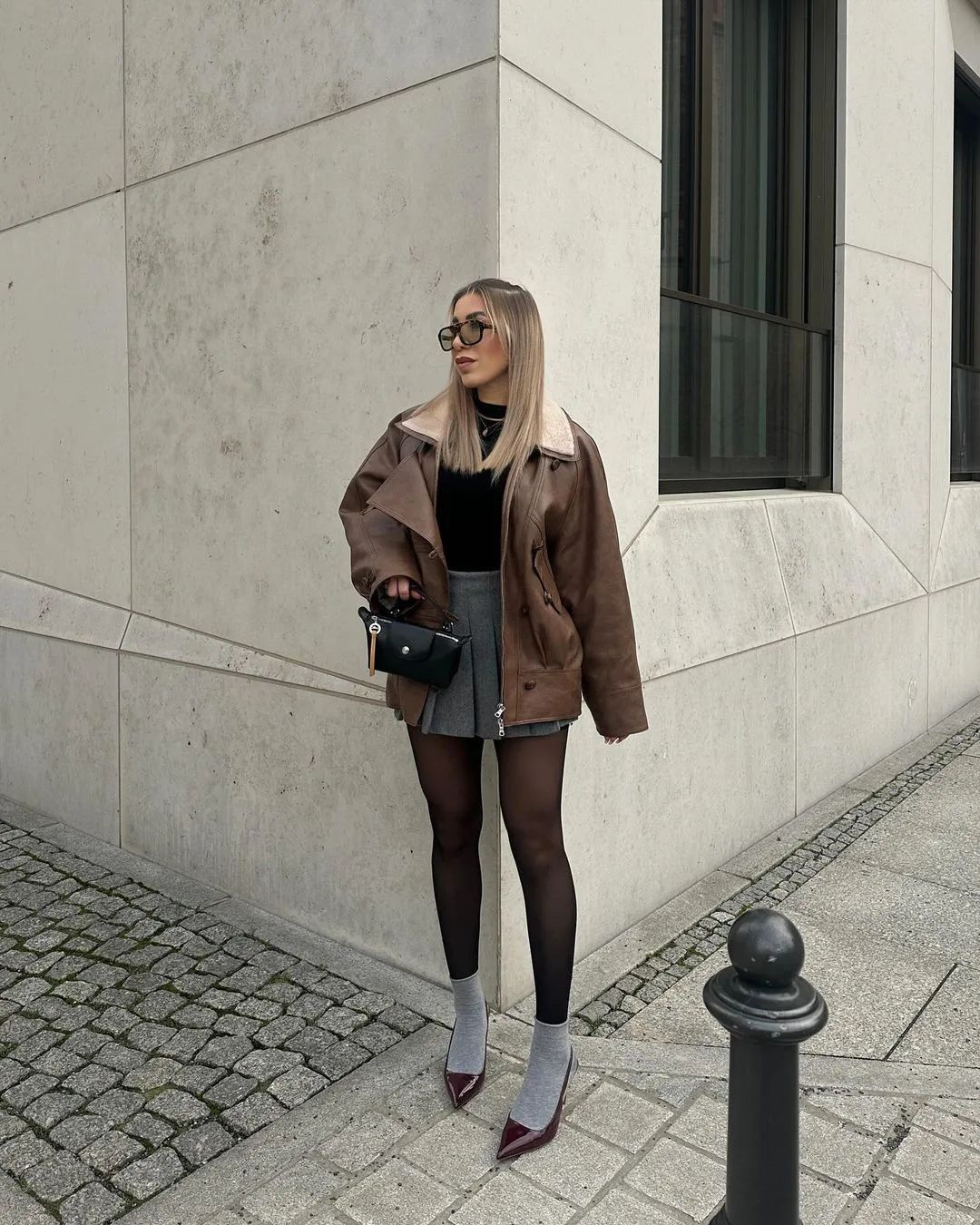 Aviator Jacket Over Mini Skirt: Edgy Winter Layers — Layered Winter Outfits 2027